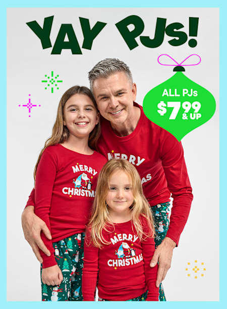 A family of three wearing matching red "Merry Christmas" shirts stands in front of a bright, colorful background with the text "Yay PJs!" and a price promotion for all PJs at $7.99 and up.