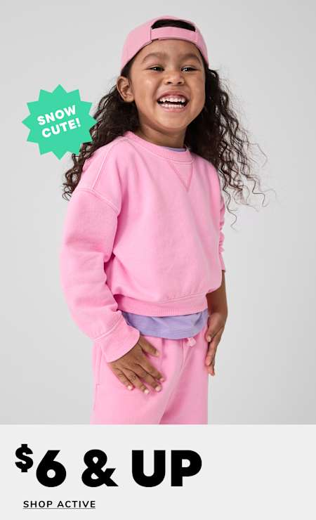 A young girl with curly hair wearing a pink sweatshirt and headband is smiling brightly against a plain white background, with a "60% OFF" text overlay.
