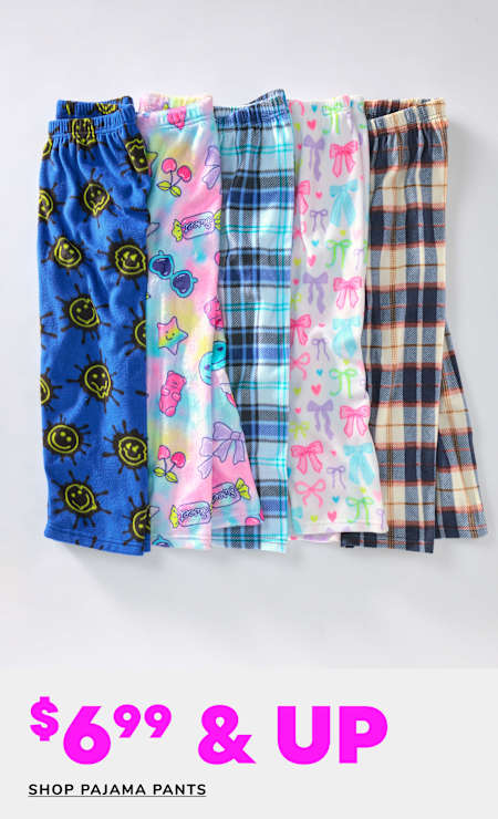 A collection of colorful and patterned pajama pants, including designs with smiley faces, plaid, and floral prints, displayed against a plain white background with a "60% OFF" promotional text.