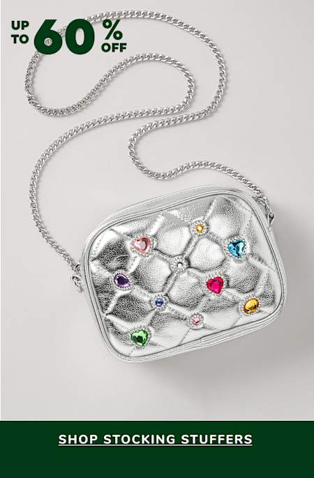 A silver metallic purse or bag with colorful gemstones or crystals embedded in it, against a plain white background with a green banner advertising a sale on "stocking stuffers".