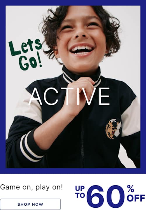 A young child with curly hair and a bright smile, wearing a black and white sports jersey, stands against a blue background with the text "Let's Go! ACTIVE" and a promotional offer for up to 60% off.