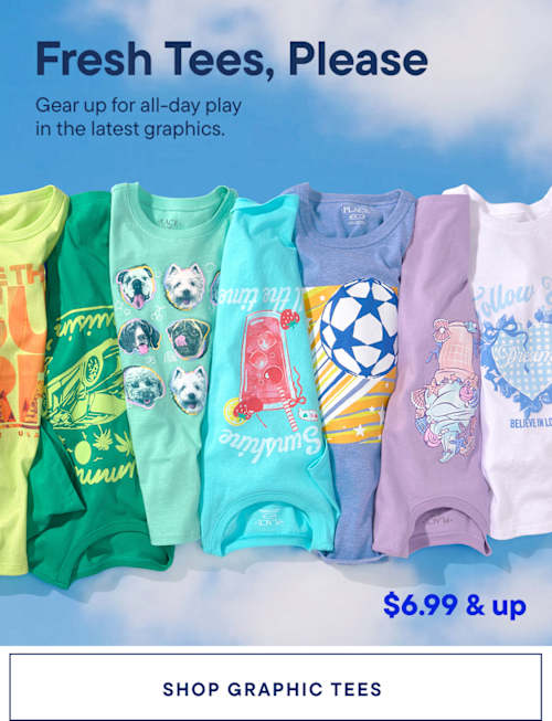 A vibrant display of colorful children's clothing, including t-shirts and tank tops, arranged in a rainbow-like pattern against a plain blue background.