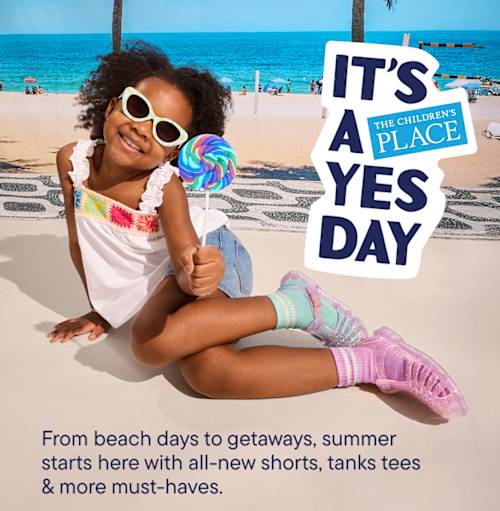 The image shows two young children, a girl and a boy, standing in front of a sign that says "IT'S A YES DAY" on a sunny beach with palm trees in the background.
