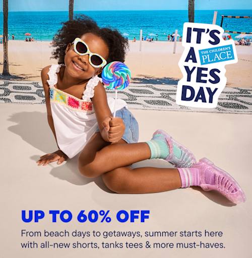 A group of young people enjoying a sunny day at the beach, with a sign that reads "It's a yes day From beach days to getaways, summer starts here with all-new shorts, tanks tees & more must-haves." in the foreground.