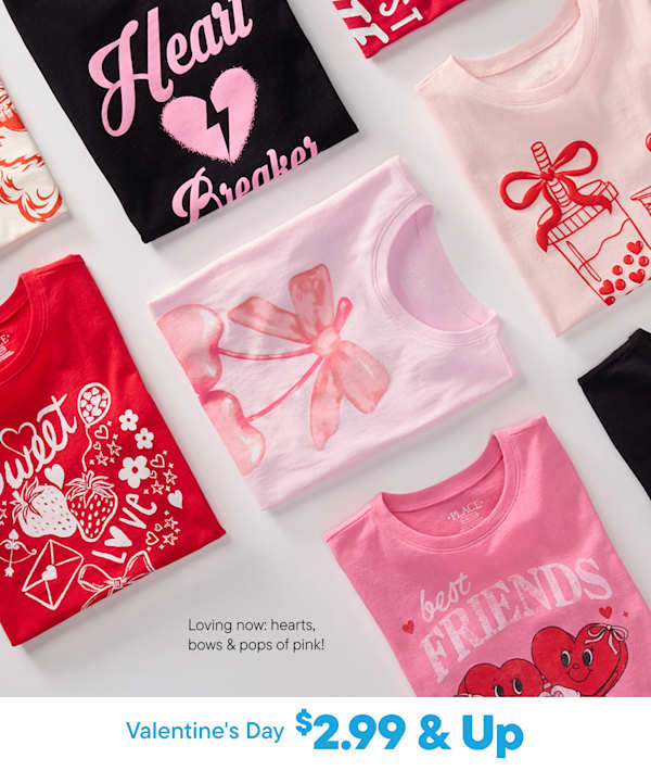 The image displays a collection of Valentine's Day-themed items, including a black t-shirt with the text "Heart Breaker", a pink bow, and various red and pink heart-shaped decorations and accessories.