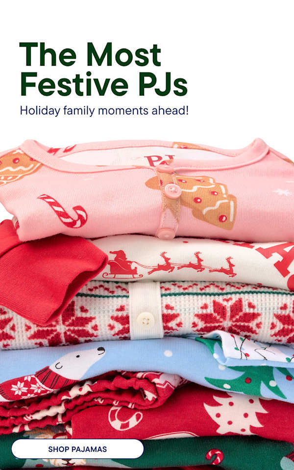 A stack of festive pajamas is in the foreground, while a smiling family in matching holiday pajamas stands in the background.