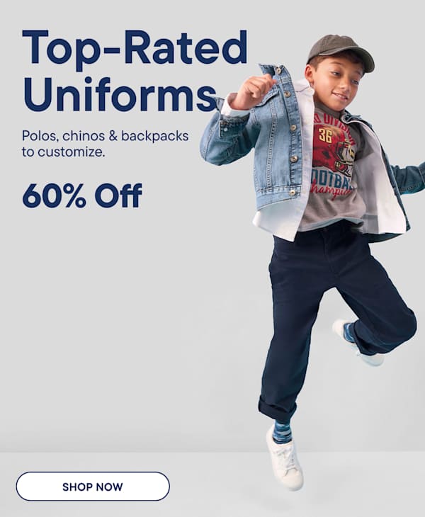 Two young girls in school uniforms stand holding hands in front of a blue background with white wavy lines and text advertising a sale.
