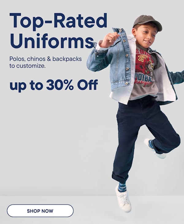 A young boy jumping in a denim jacket and navy pants is positioned against a light gray background featuring promotional text for uniforms.