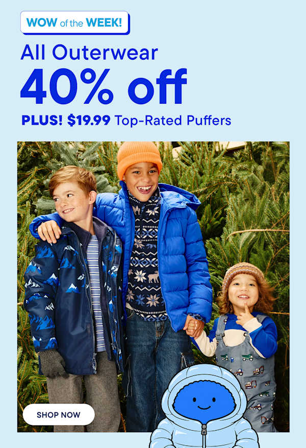 Three children wearing winter outerwear stand in the foreground against a background of evergreen trees.