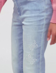 Jeans acampanados con mariposa y diamantes de imitación para niñas